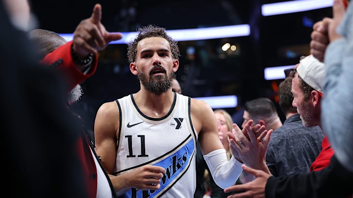 Trae Young #11 of the Atlanta Hawks leaves the court against the Milwaukee Bucks.