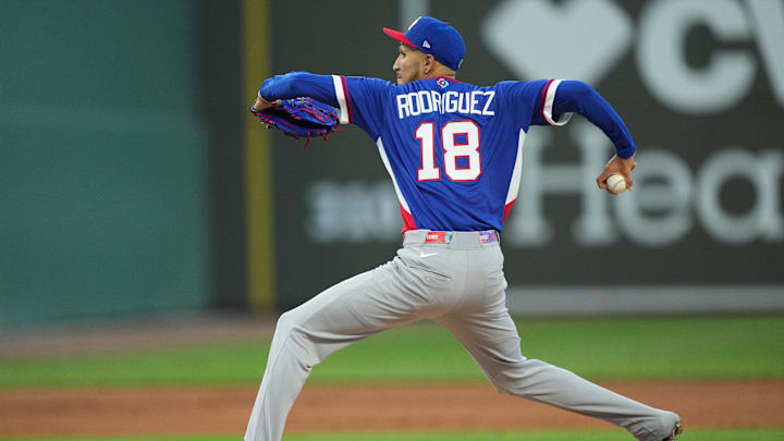Mar 3, 2026; Lee County, FL, USA;  Puerto Rico pitcher Elmer Rodriguez (18) pitches in the first inning against the Boston Red Sox. Mandatory Credit: Jim Rassol-Imagn Images