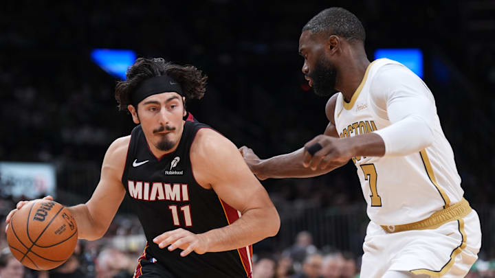 Dec 19, 2025; Boston, Massachusetts, USA; Miami Heat forward Jaime Jaquez Jr. (11) drives the ball against Boston Celtics guard Jaylen Brown (7) in the first quarter at TD Garden. Mandatory Credit: David Butler II-Imagn Images