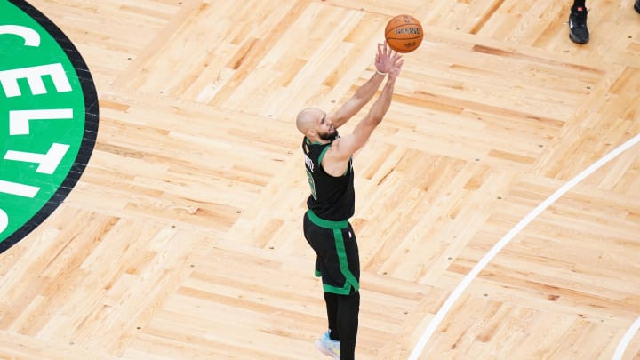 Jun 9, 2024; Boston, Massachusetts, USA; Boston Celtics guard Derrick White (9) shoots a three point shot against the Dallas Mavericks in the fourth quarter during game two of the 2024 NBA Finals at TD Garden. Mandatory Credit: David Butler II-USA TODAY Sports