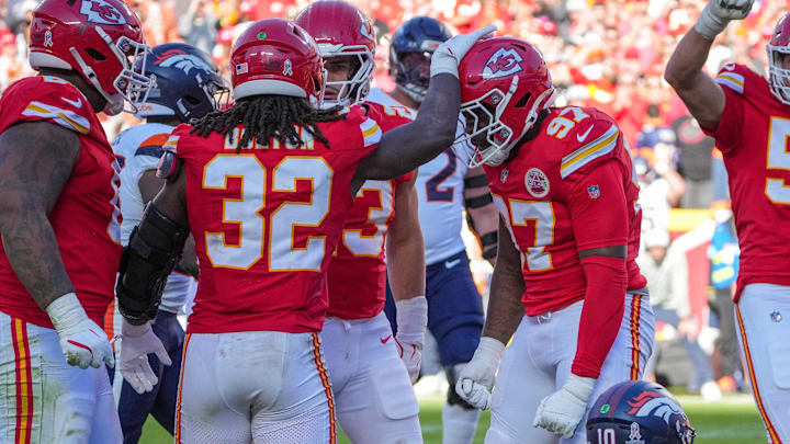 Nov 10, 2024; Kansas City, Missouri, USA; Kansas City Chiefs defensive end Felix Anudike-Uzomah (97) celebrates with linebacker Nick Bolton (32) after a sack against the Denver Broncos during the second half at GEHA Field at Arrowhead Stadium. Mandatory Credit: Denny Medley-Imagn Images