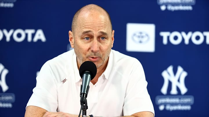 Mar 14, 2022; Tampa, FL, USA; New York Yankees general manager Brian Cashman talks with media during spring training workouts at George M. Steinbrenner Field. Mandatory Credit: Kim Klement-Imagn Images