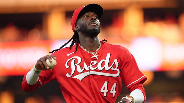 Cincinnati Reds infielder Elly De La Cruz (44) tosses a ball