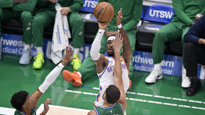 Oct 27, 2025; Dallas, Texas, USA; Oklahoma City Thunder guard Shai Gilgeous-Alexander (2) shoots over Dallas Mavericks guard Max Christie (00) and guard Klay Thompson (31) during the first quarter at the American Airlines Center. Mandatory Credit: Jerome Miron-Imagn Images