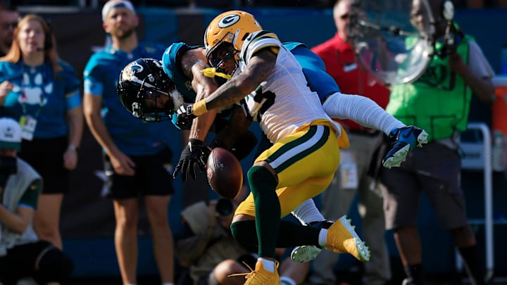Jacksonville Jaguars wide receiver Parker Washington (11) can’t haul in a touchdown reception against Green Bay Packers cornerback Jaire Alexander (23) during the fourth quarter of an NFL football matchup Sunday, Oct. 27, 2024 at EverBank Stadium in Jacksonville, Fla. The Packers edged the Jaguars 30-27 on a last-second field goal