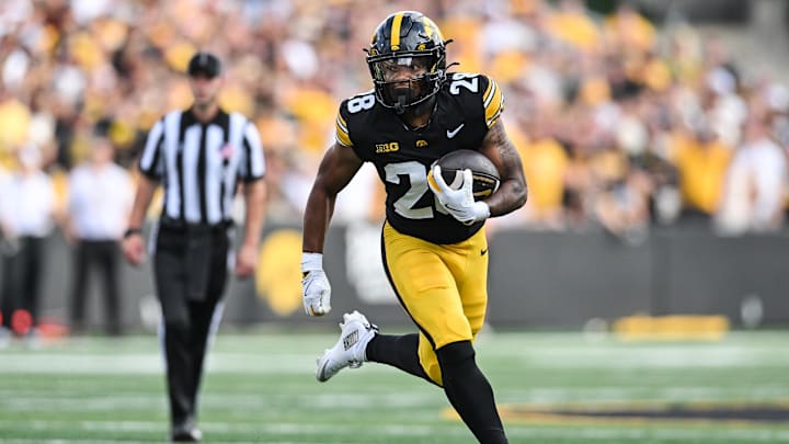 Aug 30, 2025; Iowa City, Iowa, USA; Iowa Hawkeyes running back Kamari Moulton (28) runs the ball against the Albany Great Danes during the first quarter at Kinnick Stadium. Mandatory Credit: Jeffrey Becker-Imagn Images