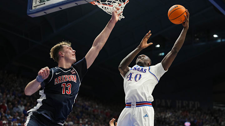 Feb 9, 2026; Lawrence, Kansas, USA; Kansas Jayhawks forward Flory Bidunga (40) shoots against Arizona Wildcats center Motiejus Krivas (13) during the second half at Allen Fieldhouse. Mandatory Credit: Jay Biggerstaff-Imagn Images