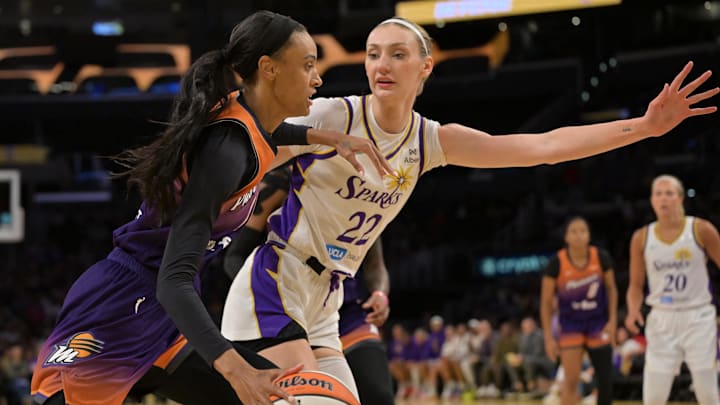 Aug 26, 2025; Los Angeles, California, USA;  Phoenix Mercury forward DeWanna Bonner (14) is defended by Los Angeles Sparks forward Cameron Brink (22) as she drives to the basket during the first half at Crypto.com Arena. Mandatory Credit: Jayne Kamin-Oncea-Imagn Images
