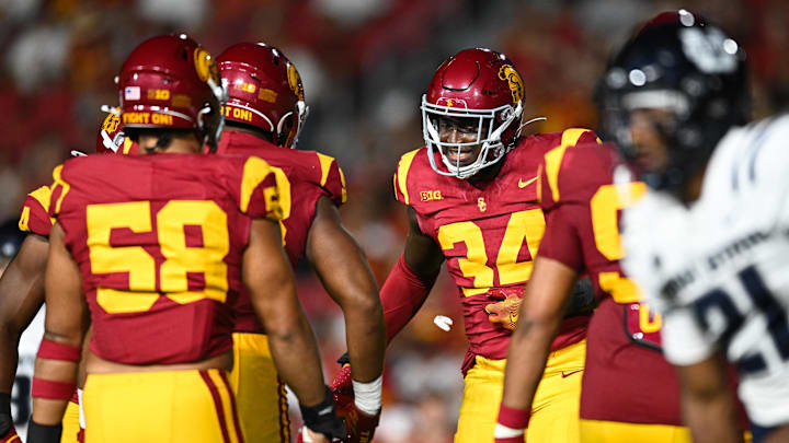 Sep 7, 2024; Los Angeles, California, USA; USC Trojans defensive end Braylan Shelby (34) celebrates after Utah State Aggies quarterback Bryson Barnes (16) (not pictured) is sacked during the third quarter at United Airlines Field at Los Angeles Memorial Coliseum. Mandatory Credit: Jonathan Hui-Imagn Images
