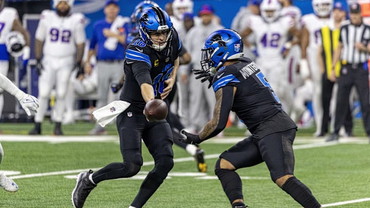 Dec 15, 2024; Detroit, Michigan, USA; Detroit Lions quarterback Jared Goff (16) hands off to running back David Montgomery (5) during the first quarter against the Buffalo Bills at Ford Field. Mandatory Credit: David Reginek-Imagn Images
