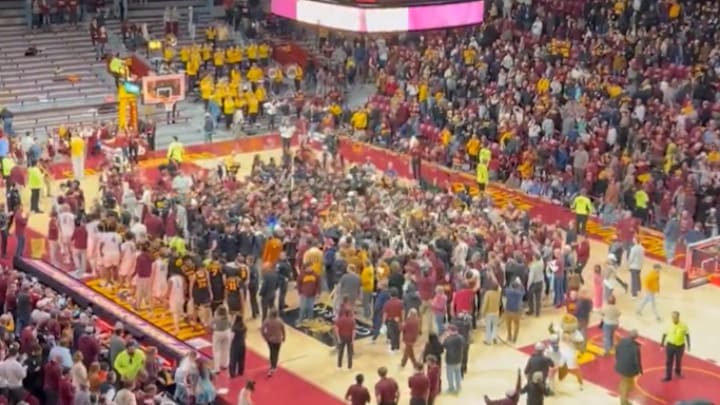 The Gophers' crowd storming the court after Tuesday's upset win over No. 19 Iowa. The Gophers' crowd storming the court after Tuesday's upset win over No. 19 Iowa.