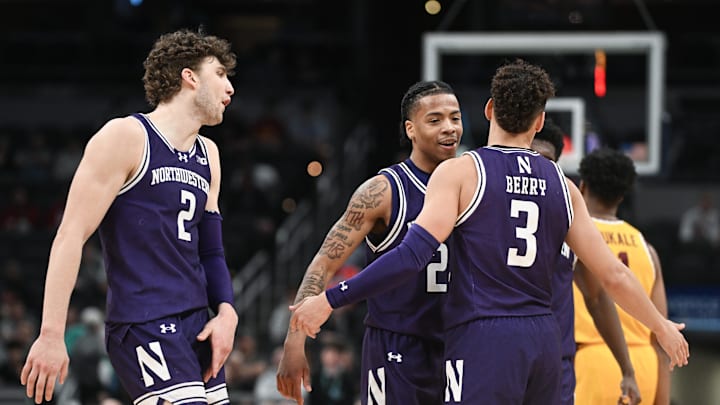 Mar 12, 2025; Indianapolis, IN, USA; Northwestern Wildcats guard K.J. Windham (24) and Northwestern Wildcats guard Ty Berry (3) celebrate after a play during the second half against the Minnesota Golden Gophers at Gainbridge Fieldhouse. Mandatory Credit: Robert Goddin-Imagn Images