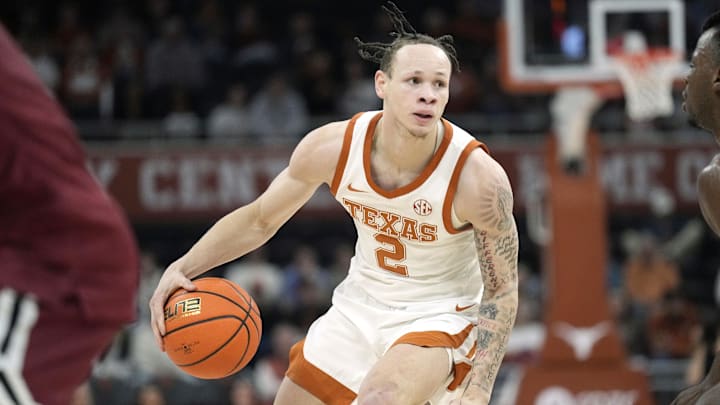 Dec 12, 2024; Austin, Texas, USA; Texas Longhorns guard Chendall Weaver (2) controls the ball during the first half against the New Mexico State Aggies at Moody Center. Mandatory Credit: Scott Wachter-Imagn Images