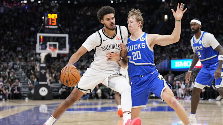 Dec 26, 2024; Milwaukee, Wisconsin, USA; Brooklyn Nets forward Cameron Johnson (2) drives for the basket against Milwaukee Bucks guard AJ Green (20) during the fourth quarter at Fiserv Forum. Mandatory Credit: Jeff Hanisch-Imagn Images Dec 26, 2024; Milwaukee, Wisconsin, USA; Brooklyn Nets forward Cameron Johnson (2) drives for the basket against Milwaukee Bucks guard AJ Green (20) during the fourth quarter at Fiserv Forum. Mandatory Credit: Jeff Hanisch-Imagn Images