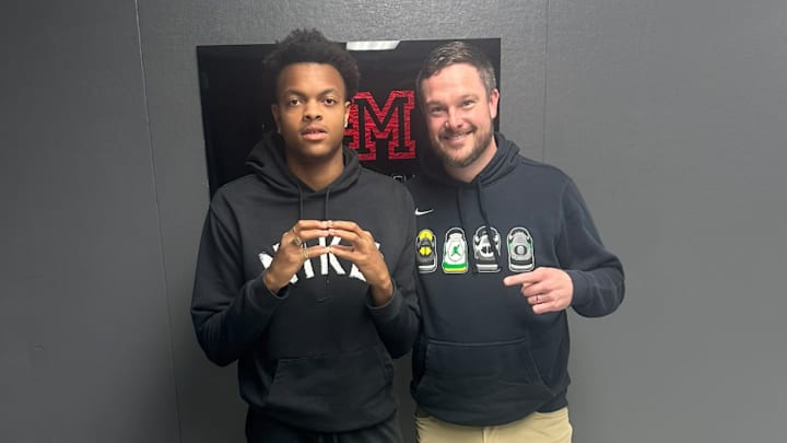 Five-star athlete Brandon Arrington poses with Oregon Ducks coach Dan Lanning