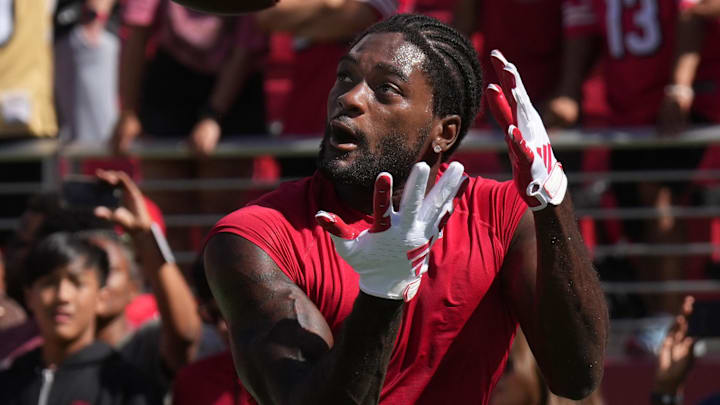 Oct 6, 2024; Santa Clara, California, USA; San Francisco 49ers wide receiver Brandon Aiyuk (11) warms up before the game against the Arizona Cardinals at Levi's Stadium. Mandatory Credit: Darren Yamashita-Imagn Images Oct 6, 2024; Santa Clara, California, USA; San Francisco 49ers wide receiver Brandon Aiyuk (11) warms up before the game against the Arizona Cardinals at Levi's Stadium. Mandatory Credit: Darren Yamashita-Imagn Images