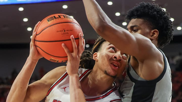 Houston Cougars guard Kingston Flemings drives to the basket against Colorado Buffaloes guard Isaiah Johnson