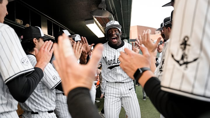 Vanderbilt centerfielder RJ Austin high fives his teammates as the Commodores prepared to face Texas A&M on Friday.