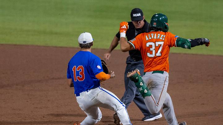 Florida's Landon Stripling (13) beats MiamiÕs Alonzo Alvarez (37) to the bag in the sixth in NCAA Gainesville Regionals at Condron Family Ballpark in Gainesville, Florida, Saturday, May 30, 2026. The Gators beat the Hurricanes 22-10. [Cyndi Chambers/ Gainesville Sun] 2026
