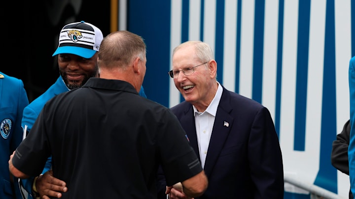 Former head coach Tom Coughlin shakes hands with a familiar person on the sideline during the second quarter of an NFL football matchup Sunday, Oct. 6, 2024 at EverBank Stadium in Jacksonville, Fla. [Corey Perrine/Florida Times-Union]
