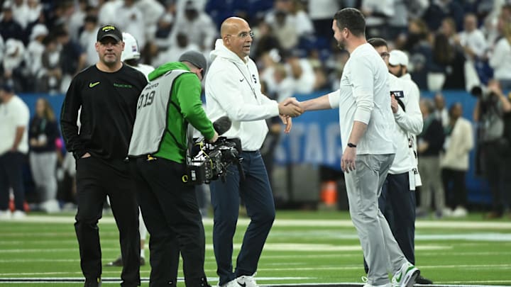 Penn State Nittany Lions head coach James Franklin shakes hands with Oregon Ducks head coach Dan Lanning at the 2024 Big Ten Championship Game.