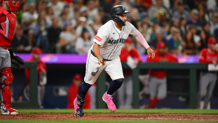 Sep 13, 2025; Seattle, Washington, USA; Seattle Mariners first baseman Josh Naylor (12) runs towards first base after hitting a 2-RBI single against the Los Angeles Angels during the fifth inning at T-Mobile Park. Mandatory Credit: Steven Bisig-Imagn Images