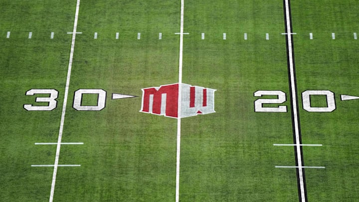 The Mountain West conference logo on the field at Allegiant Stadium. Mandatory Credit: Kirby Lee-Imagn Images The Mountain West conference logo on the field at Allegiant Stadium. Mandatory Credit: Kirby Lee-Imagn Images