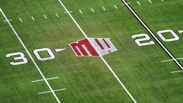 The Mountain West conference logo on the field at Allegiant Stadium. Mandatory Credit: Kirby Lee-Imagn Images