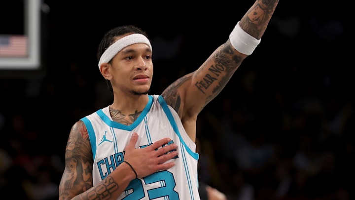 Nov 19, 2024; Brooklyn, New York, USA; Charlotte Hornets guard Tre Mann (23) reacts after receiving a technical foul during the third quarter against the Brooklyn Nets at Barclays Center. Mandatory Credit: Brad Penner-Imagn Images
