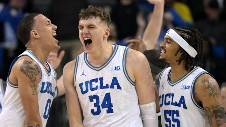Feb 4, 2025; Los Angeles, California, USA; UCLA Bruins guard Kobe Johnson (0) and guard Skyy Clark (55) celebrate with forward Tyler Bilodeau (34) after a basket during the second half against the Michigan State Spartans at Pauley Pavilion presented by Wescom. Mandatory Credit: Jayne Kamin-Oncea-Imagn Images Feb 4, 2025; Los Angeles, California, USA; UCLA Bruins guard Kobe Johnson (0) and guard Skyy Clark (55) celebrate with forward Tyler Bilodeau (34) after a basket during the second half against the Michigan State Spartans at Pauley Pavilion presented by Wescom. Mandatory Credit: Jayne Kamin-Oncea-Imagn Images