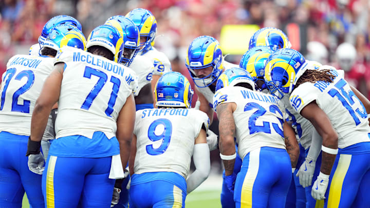 Sep 15, 2024; Glendale, Arizona, USA; Los Angeles Rams quarterback Matthew Stafford (9) huddles teammates against the Arizona Cardinals during the first half at State Farm Stadium. Mandatory Credit: Joe Camporeale-Imagn Images