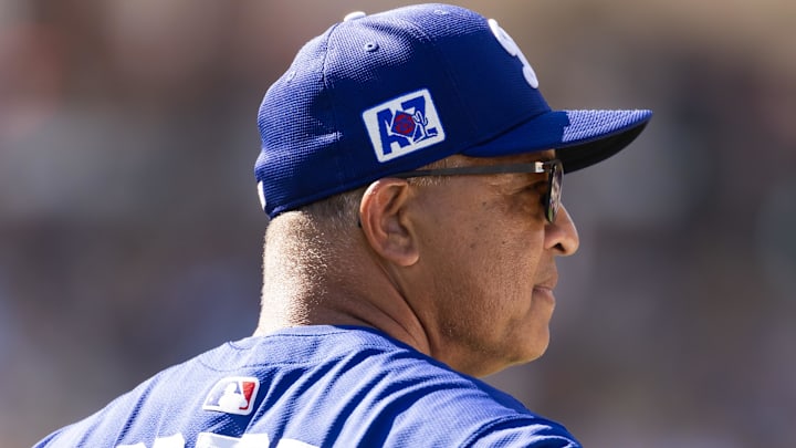 Feb 20, 2025; Phoenix, Arizona, USA; Los Angeles Dodgers manager Dave Roberts against the Chicago Cubs during a spring training game at Camelback Ranch-Glendale. Mandatory Credit: Mark J. Rebilas-Imagn Images