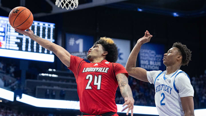 Louisville Cardinals guard Chucky Hepburn (24) goes for a layup against Kentucky Wildcats guard Jaxson Robinson (2) during their game on Saturday, Dec. 14, 2024 at Rupp Arena in Lexington, Ky.