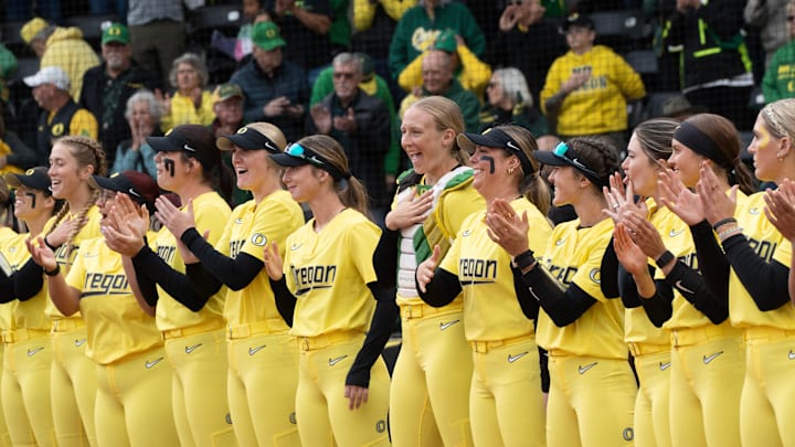 The Oregon softball team lines up for the National Anthem before their game against Michigan State at Jane Sanders Stadium.
