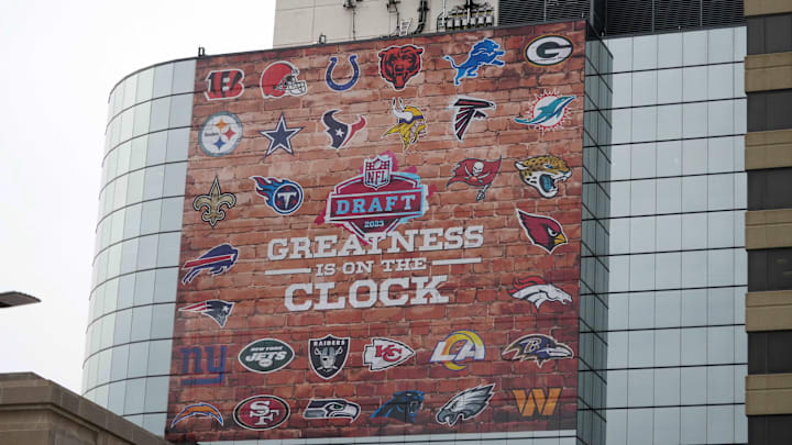 Signage promoting the NFL Draft with team logos.