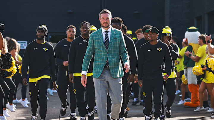 Oregon Ducks coach Dan Lanning, quarterback dillon gabriel, linebacker jeffrey bassa walk to Autzen Stadium. How to watch Oregon Ducks vs. Ohio State Buckeyes