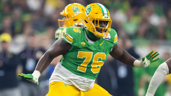 Jan 1, 2024; Glendale, AZ, USA; Oregon Ducks offensive lineman Josh Conerly Jr. (76) against the Liberty Flames during the 2024 Fiesta Bowl at State Farm Stadium. Mandatory Credit: Mark J. Rebilas-Imagn Images