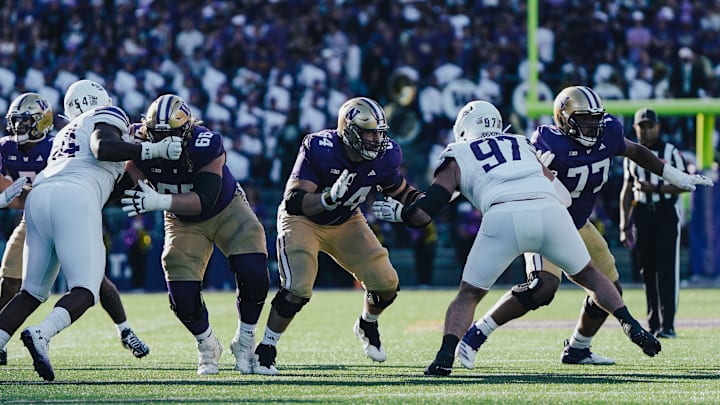 Landen Hatchett, Gaard Memmelaar and Max McCree provide pocket protection against Northwestern.