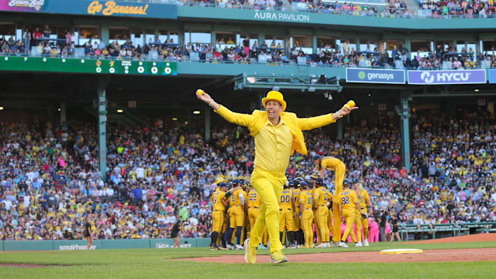 Boston MA-Team owner Jesse Cole runs toward the stands with tee shirts during the Savannah Bananas first Banana Ball game at Fenway Park on Saturday, June 8, 2024.