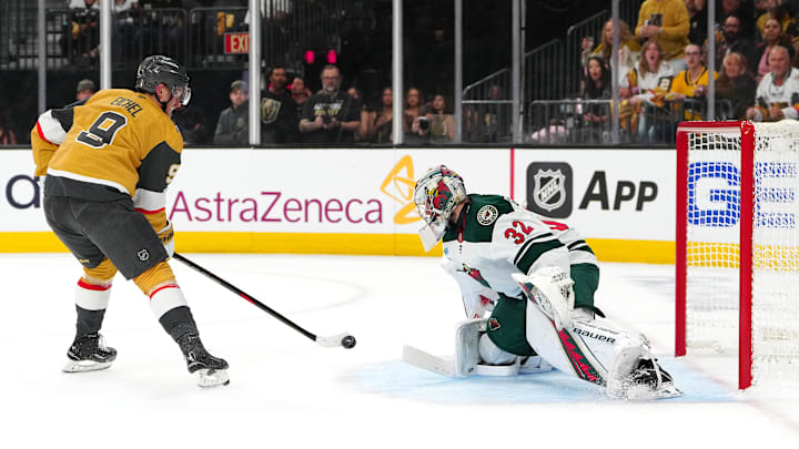 Apr 20, 2025; Las Vegas, Nevada, USA; Vegas Golden Knights center Jack Eichel (9) shoots against Minnesota Wild goaltender Filip Gustavsson (32) during the second period of  game one of the first round of the 2025 Stanley Cup Playoffs at T-Mobile Arena. Mandatory Credit: Stephen R. Sylvanie-Imagn Images