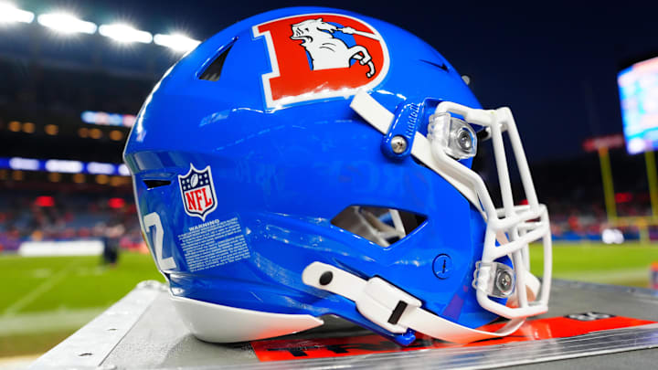 Jan 5, 2025; Denver, Colorado, USA; Detailed view of a Denver Broncos throwback helmet following the win against the Kansas City Chiefs at Empower Field at Mile High. Mandatory Credit: Ron Chenoy-Imagn Images