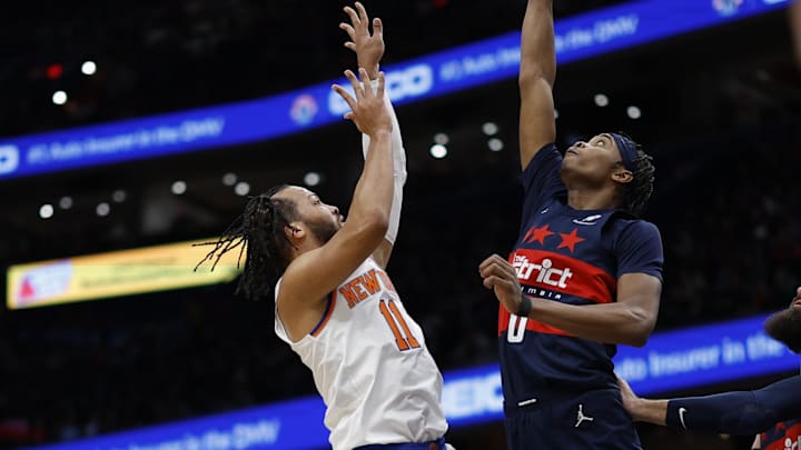 Dec 28, 2024; Washington, District of Columbia, USA; New York Knicks guard Jalen Brunson (11)shoots the ball as Washington Wizards guard Bilal Coulibaly (0) defends in the first quarter at Capital One Arena. Mandatory Credit: Geoff Burke-Imagn Images