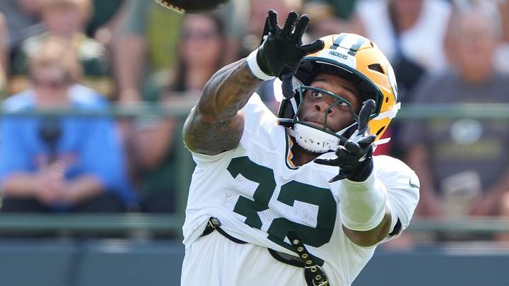 Green Bay Packers running back MarShawn Lloyd (32) catches a pass during the sixth day of training camp on Aug. 4, 2026, at Ray Nitschke Field in Ashwaubenon, Wis.