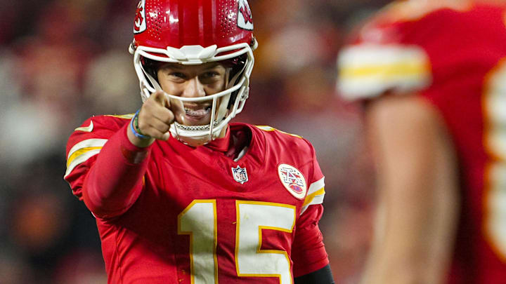 Dec 8, 2024; Kansas City, Missouri, USA; Kansas City Chiefs quarterback Patrick Mahomes (15) points to tight end Travis Kelce (87) after a play during the second half against the Los Angeles Chargers at GEHA Field at Arrowhead Stadium. Mandatory Credit: Jay Biggerstaff-Imagn Images