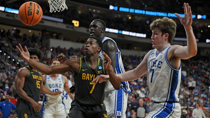 Mar 23, 2025; Raleigh, NC, USA; Baylor Bears guard VJ Edgecombe (7) goes for the ball during the first half against Duke Blue Devils guard Kon Knueppel (7) in the second round of the NCAA Tournament at Lenovo Center. Mandatory Credit: Zachary Taft-Imagn Images