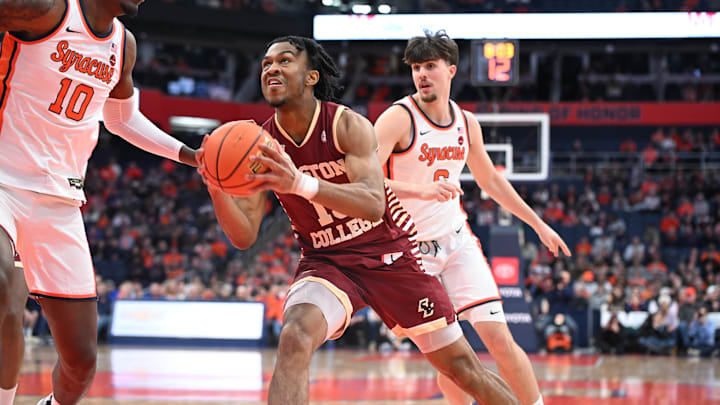 Boston College Eagles guard Donald Hand Jr. (13) looks to the basket to take a shot as Syracuse Orange center Naheem McLeod (10) and forward Petar Majstorovic (6) defend in the first half at the JMA Wireless Dome.