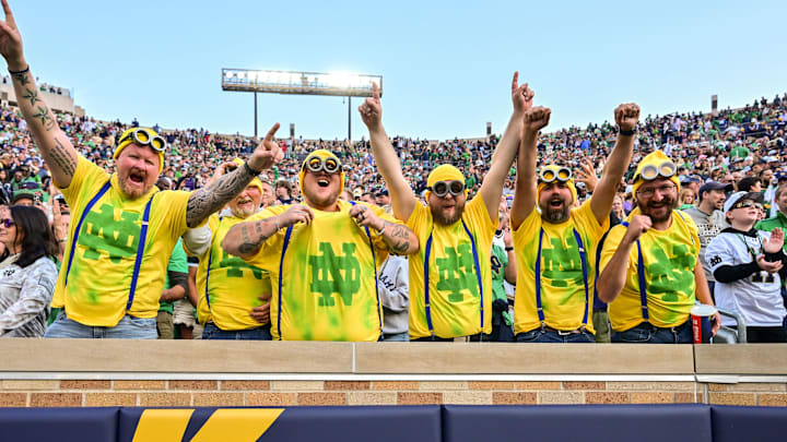 Oct 12, 2024; South Bend, Indiana, USA; Fans dressed as the Minions celebrate in the third quarter of the game between the Notre Dame Fighting Irish and the Stanford Cardinal at Notre Dame Stadium. Oct 12, 2024; South Bend, Indiana, USA; Fans dressed as the Minions celebrate in the third quarter of the game between the Notre Dame Fighting Irish and the Stanford Cardinal at Notre Dame Stadium.