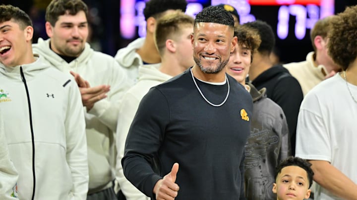 Feb 19, 2025; South Bend, Indiana, USA; Notre Dame head football coach Marcus Freeman and team are honored in the first half of the game between the Notre Dame Fighting Irish and the SMU Mustangs at the Purcell Pavilion. 