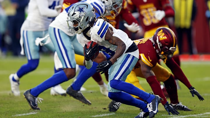 Nov 24, 2024; Landover, Maryland, USA; Dallas Cowboys wide receiver KaVontae Turpin (9) breaks a tackle by Washington Commanders safety Jeremy Reaves (39) to run for a touchdown on a kickoff return during the fourth quarter at Northwest Stadium. Mandatory Credit: Peter Casey-Imagn Images