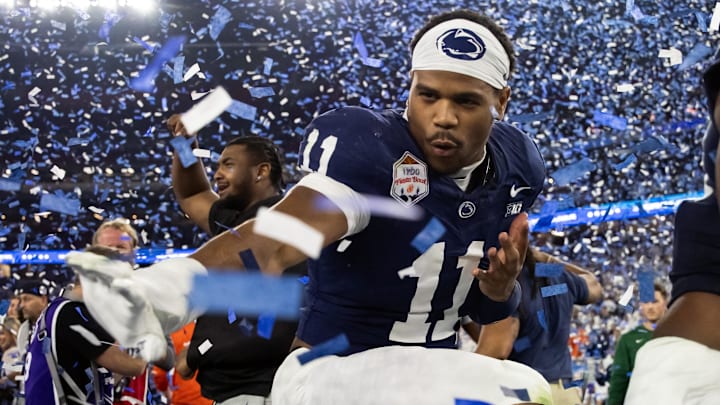 Dec 31, 2024; Glendale, AZ, USA; Penn State Nittany Lions defensive end Abdul Carter (11) celebrates with the Heisman pose after defeating the Boise State Broncos in the Fiesta Bowl at State Farm Stadium. Mandatory Credit: Mark J. Rebilas-Imagn Images